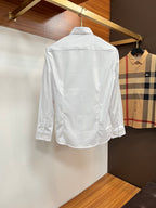 Burberry long-sleeve button-up shirt in white, shown from the back with button placket