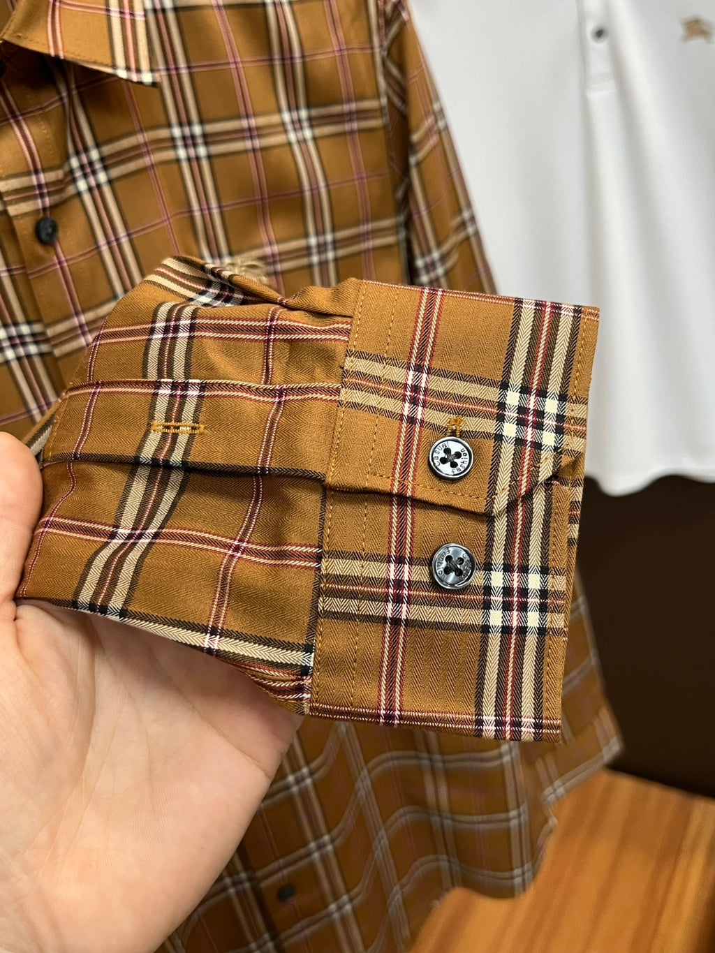 Burberry plaid cuff with two dark buttons, brown tan with white and navy stripes