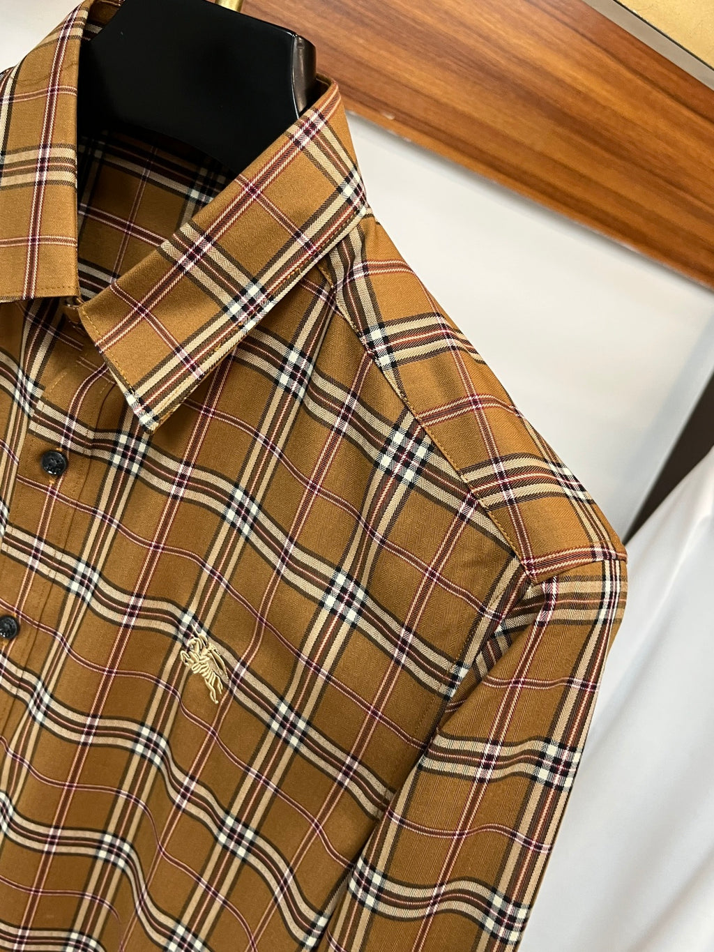 Burberry plaid button-up shirt shoulder seam and yoke, brown tan with navy and white