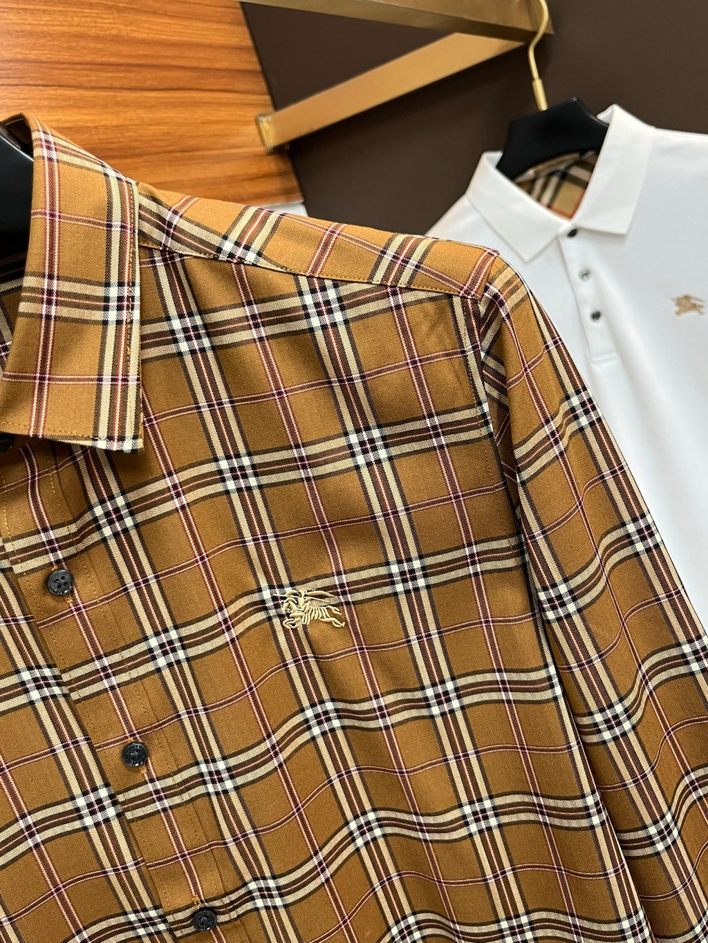 Burberry plaid button-up shirt sleeve cuff with buttons, brown tan and white navy
