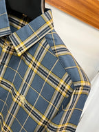 Plaid dress shirt chest pocket with embroidered logo and buttoned flap