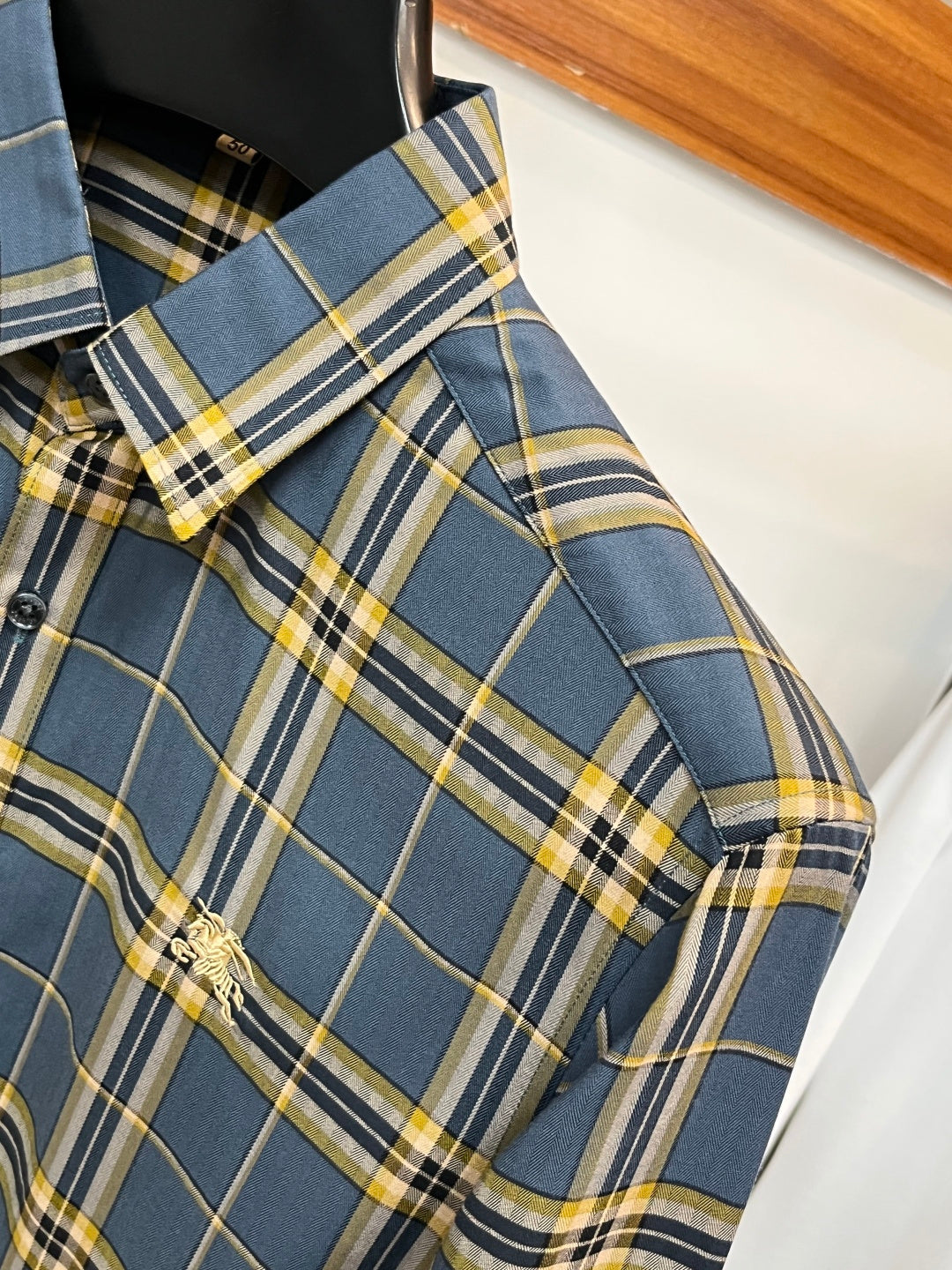 Plaid dress shirt chest pocket with embroidered logo and buttoned flap