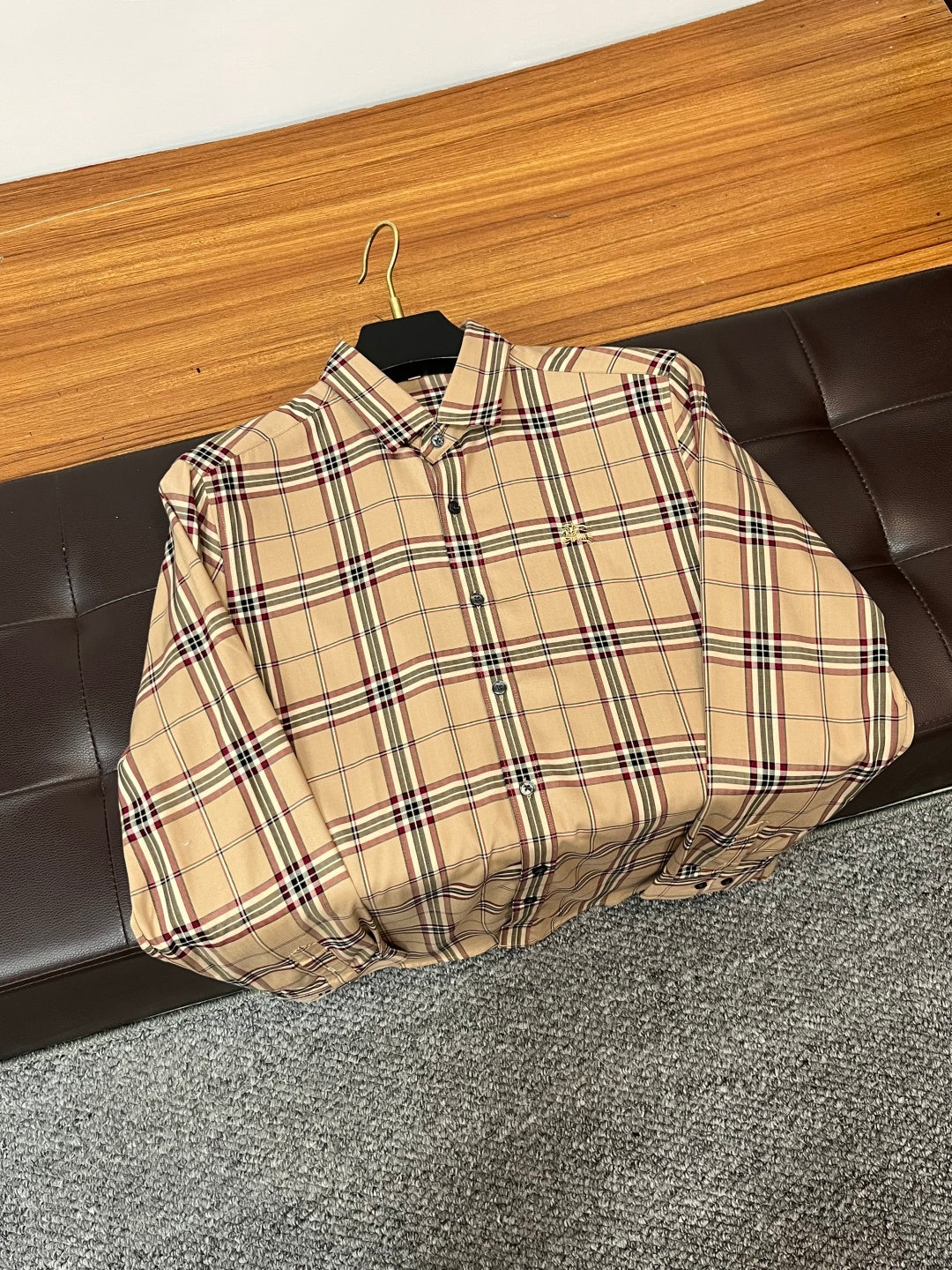 Beige plaid long-sleeve button-up shirt hanging on a hanger
