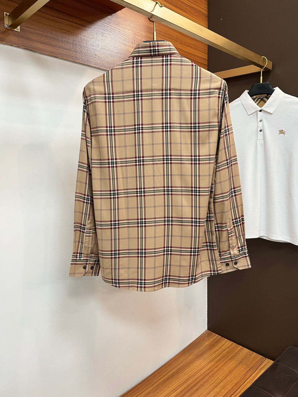 Beige plaid long-sleeve button-up shirt, back view, with buttoned cuffs
