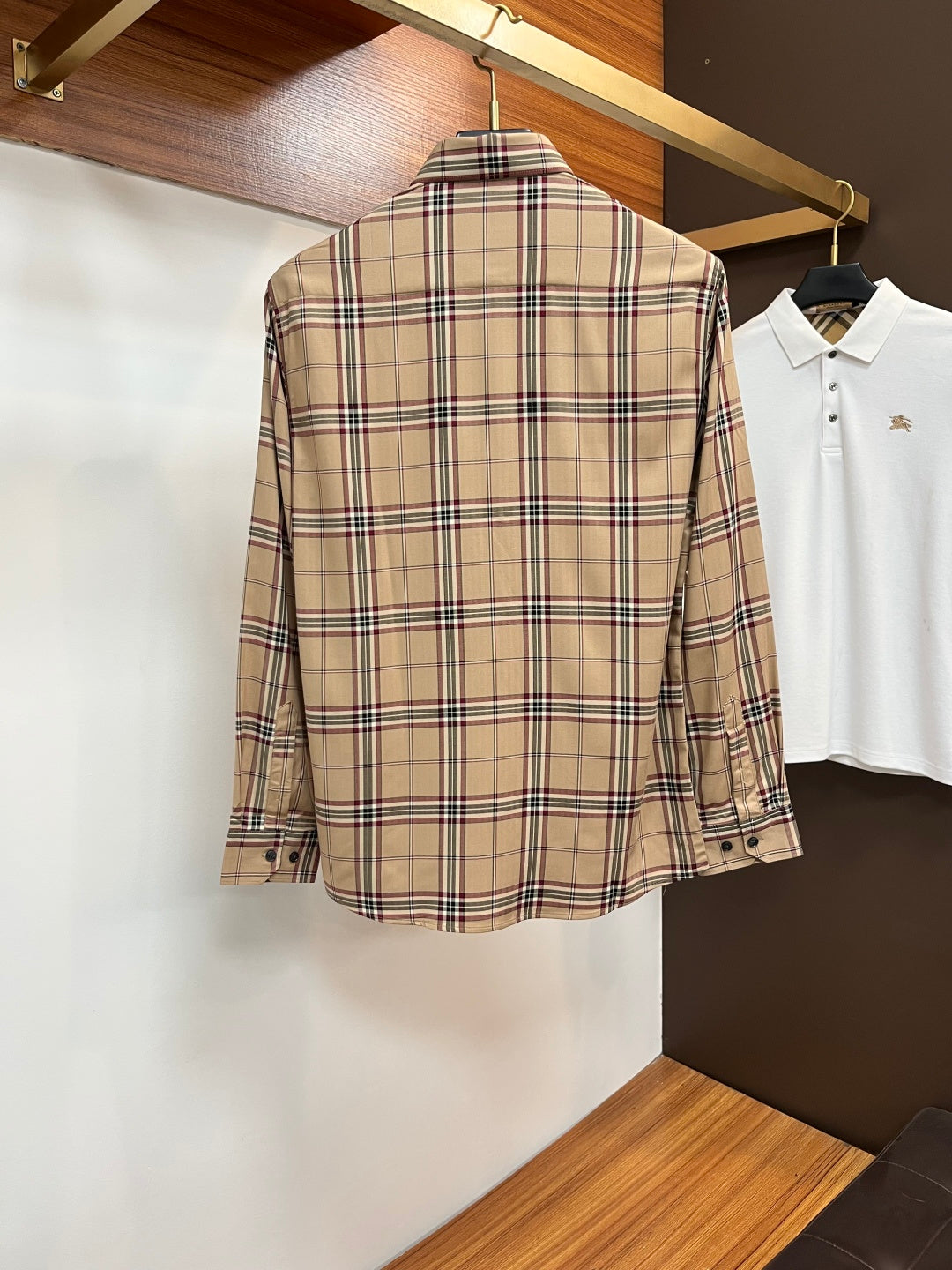 Beige plaid long-sleeve button-up shirt, back view, with buttoned cuffs