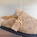Monogram slide sandal buckle detail on beige suede with strap.