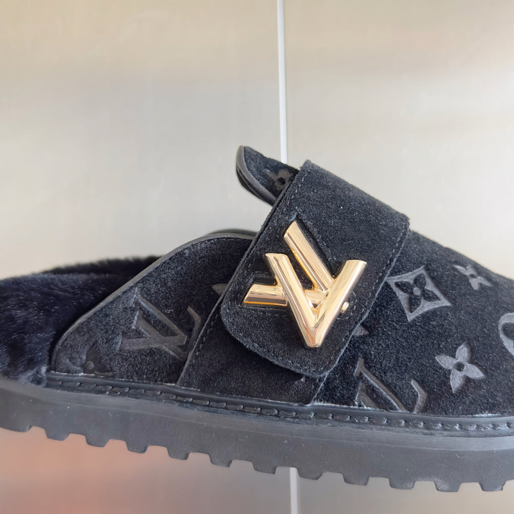 Louis Vuitton monogram slide sandal with gold V-shaped buckle on dark suede