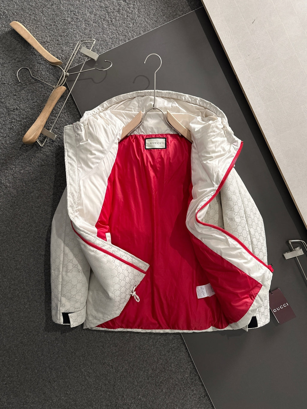 Gucci hooded jacket with hood open, light-gray monogram and red interior