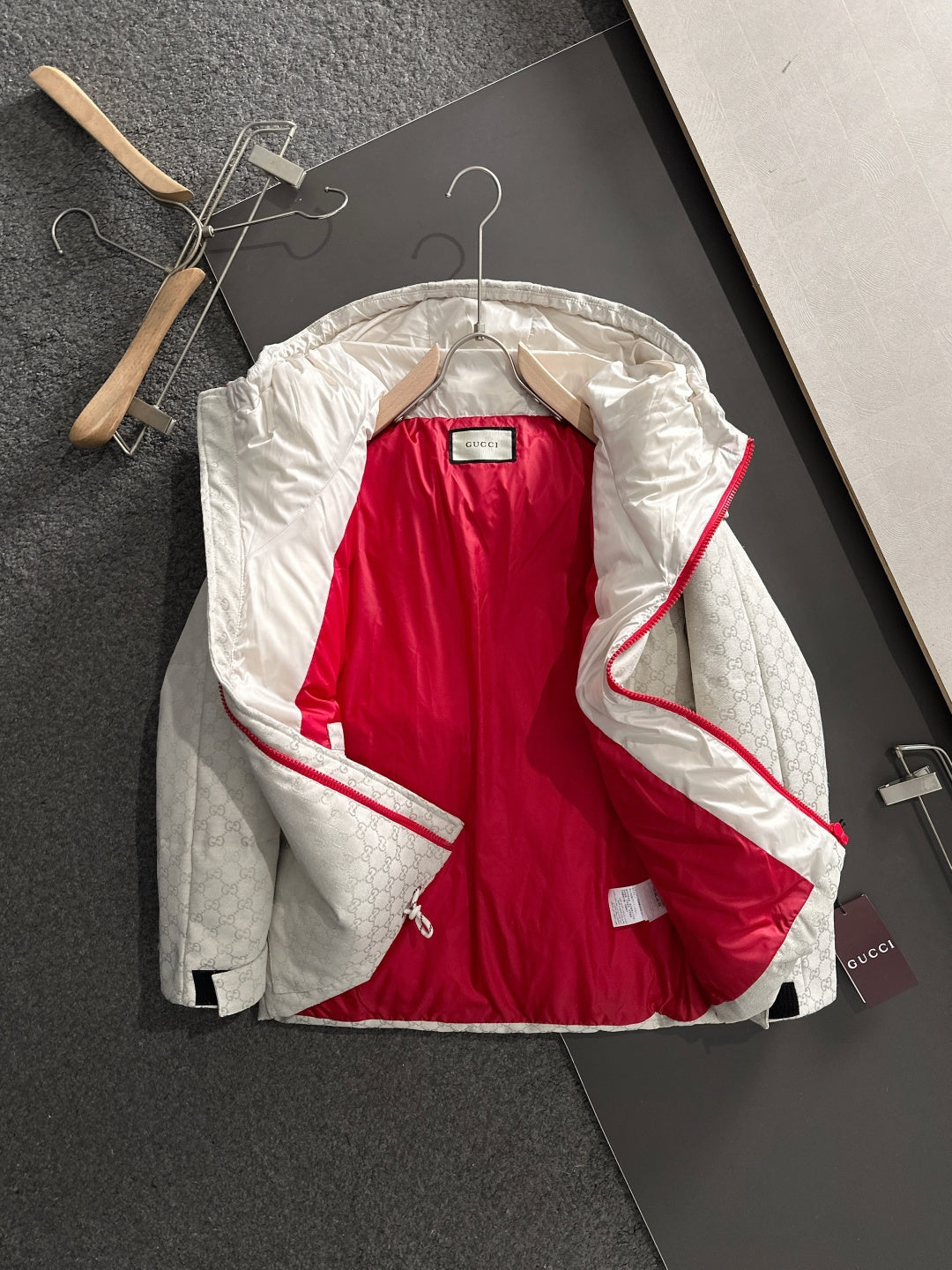 Gucci hooded jacket with hood open, light-gray monogram and red interior