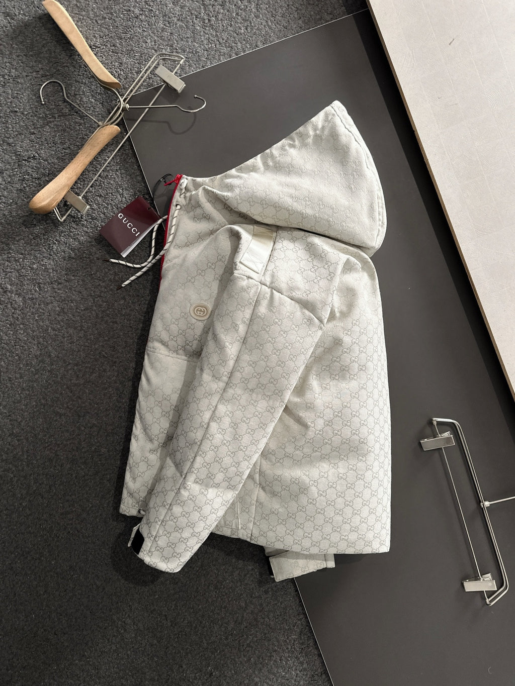Gucci hooded jacket, light-gray monogram pattern, front with red zipper