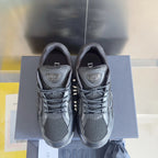Dior unisex sneakers dark gray, front view pair with lace-up and logo heel tabs