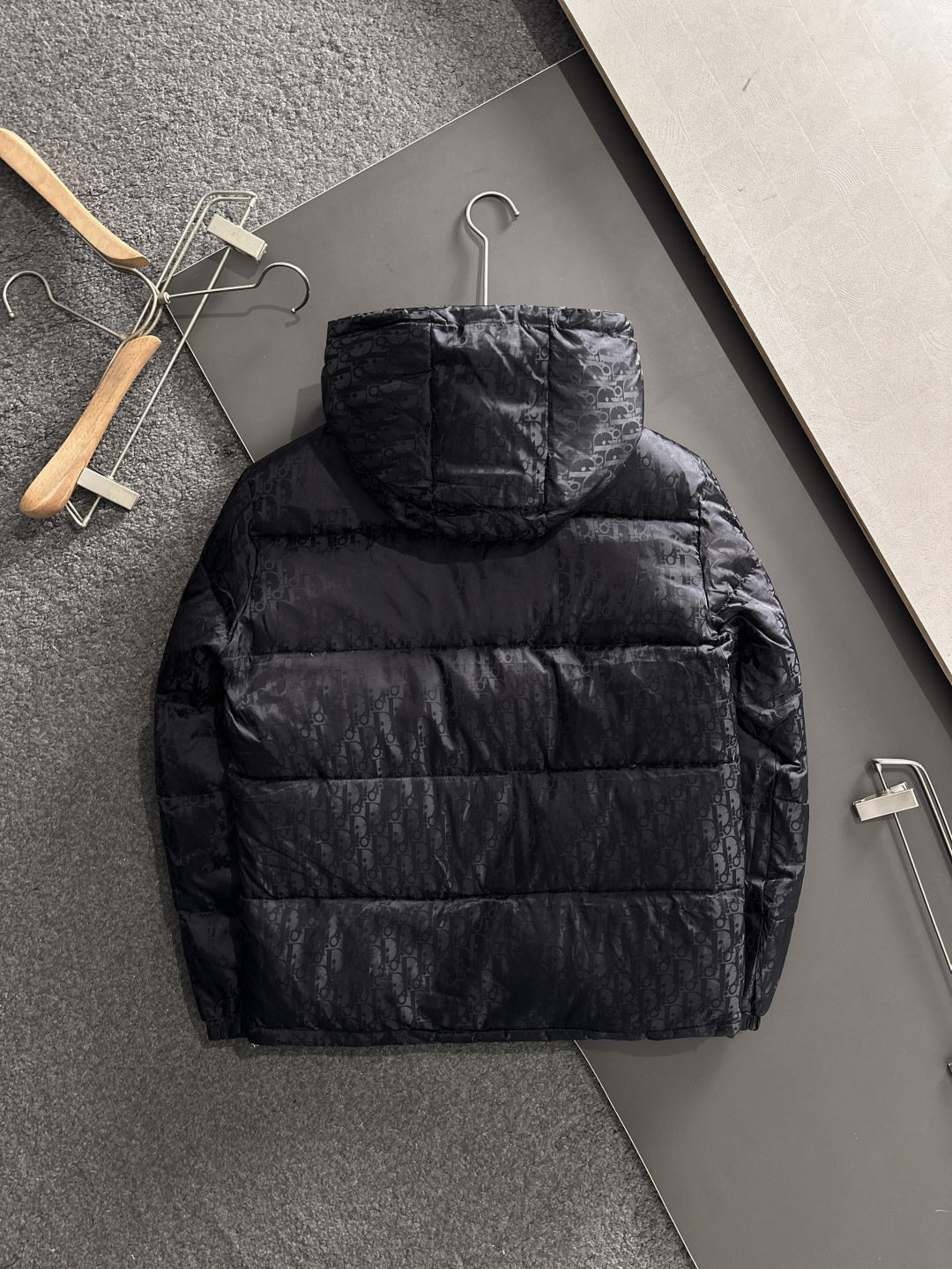 Long black puffer jacket with hood, quilted back, front zipper, Dior monogram