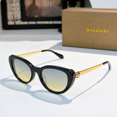 Bvlgari sunglasses with black frames, gold arms, and light amber tinted lenses