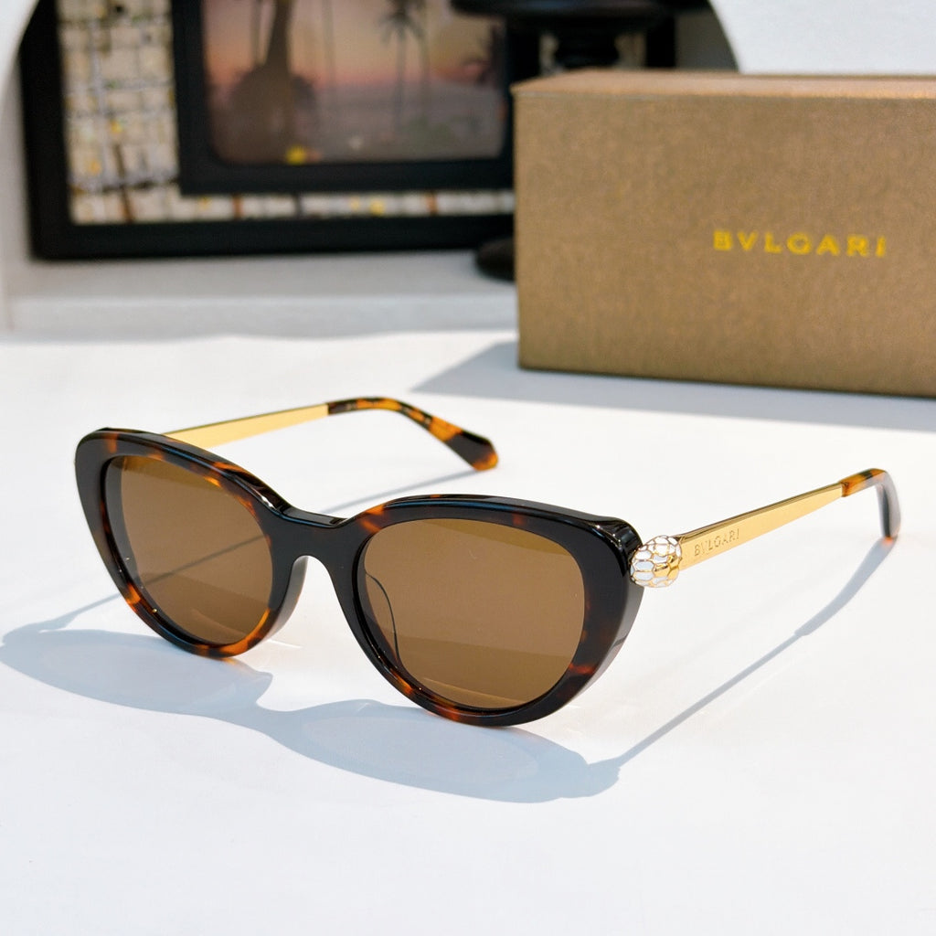 Bvlgari sunglasses with dark tortoiseshell accents and amber tinted lenses