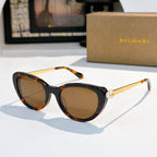 Bvlgari sunglasses with dark tortoiseshell accents and amber tinted lenses
