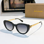 Bvlgari sunglasses with black frames and dark purple tinted lenses
