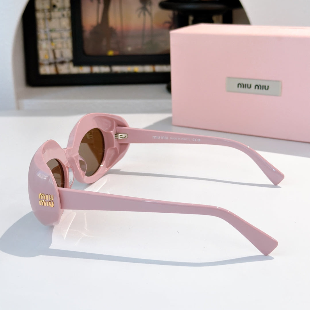 MiuMiu pink sunglasses, rounded frames, side view with temple logo