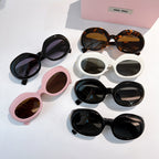 MiuMiu sunglasses assortment with multiple round frames in black, pink, white, and tortoiseshell