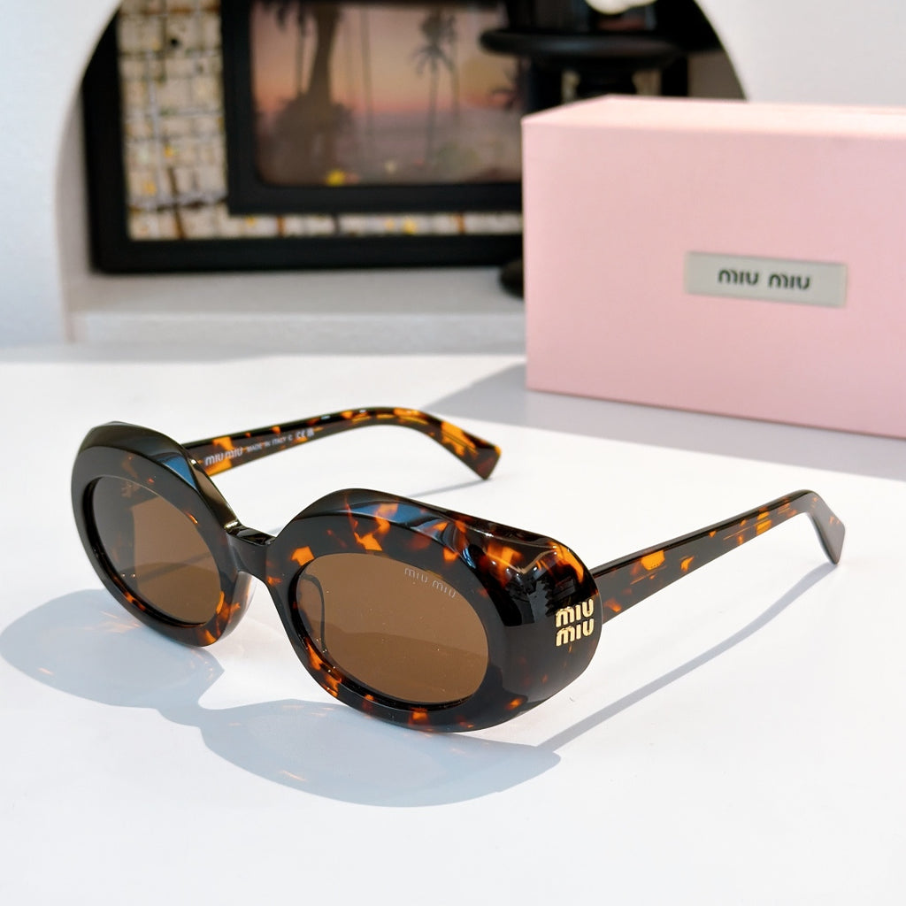 MiuMiu tortoiseshell sunglasses with round dark lenses and logo on temples