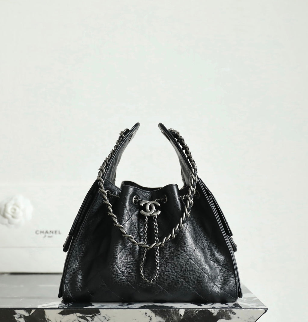 Chanel black quilted leather bucket bag with chain handles and CC clasp