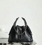 Chanel black quilted leather bucket bag with chain handles and CC clasp