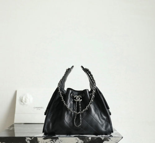 Chanel black quilted leather bucket bag with chain handles and CC logo