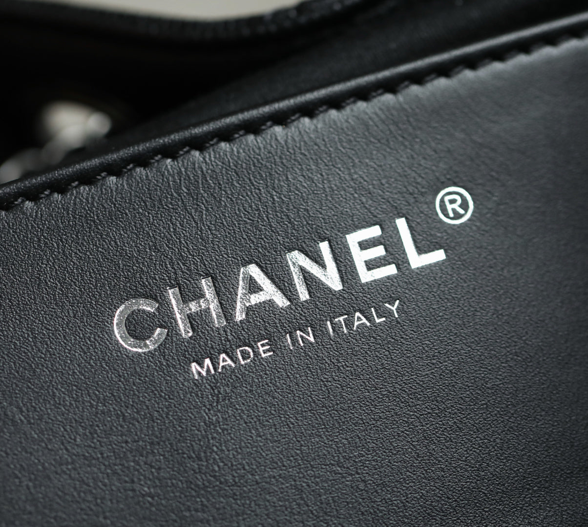 Chanel logo stamp on black leather lining, made in Italy