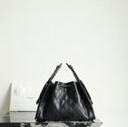 Chanel black quilted leather bucket bag with double chain handles