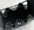 Chanel black leather bag interior with chain strap and metal CC clasp