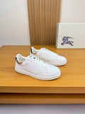 White leather sneakers with lace-up front and low-profile rubber sole