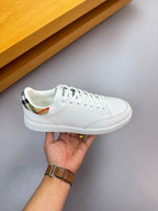 White leather sneaker with multicolor check collar and lace-up closure