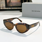 Balenciaga sunglasses, tortoiseshell frames with brown gradient lenses and gold logo