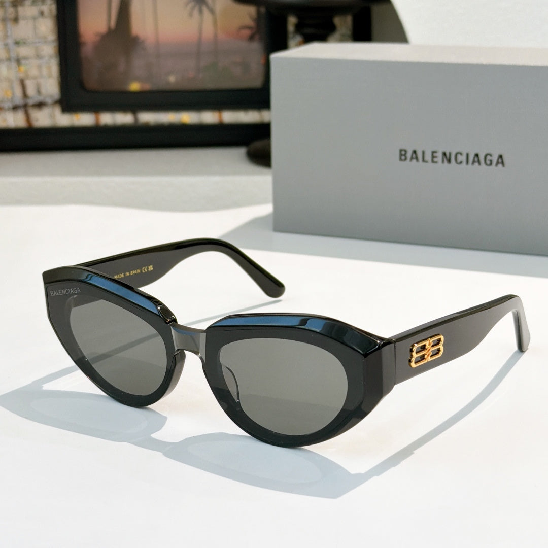 Balenciaga sunglasses, dark navy frames with gray lenses and gold logo