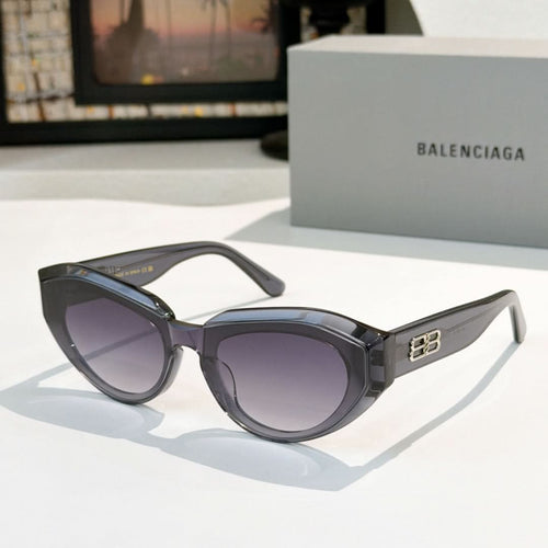 Balenciaga sunglasses, black frames with purple-tinted lenses and gold logo