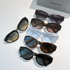 Balenciaga sunglasses set, multiple frames in black, blue, brown, and tortoiseshell