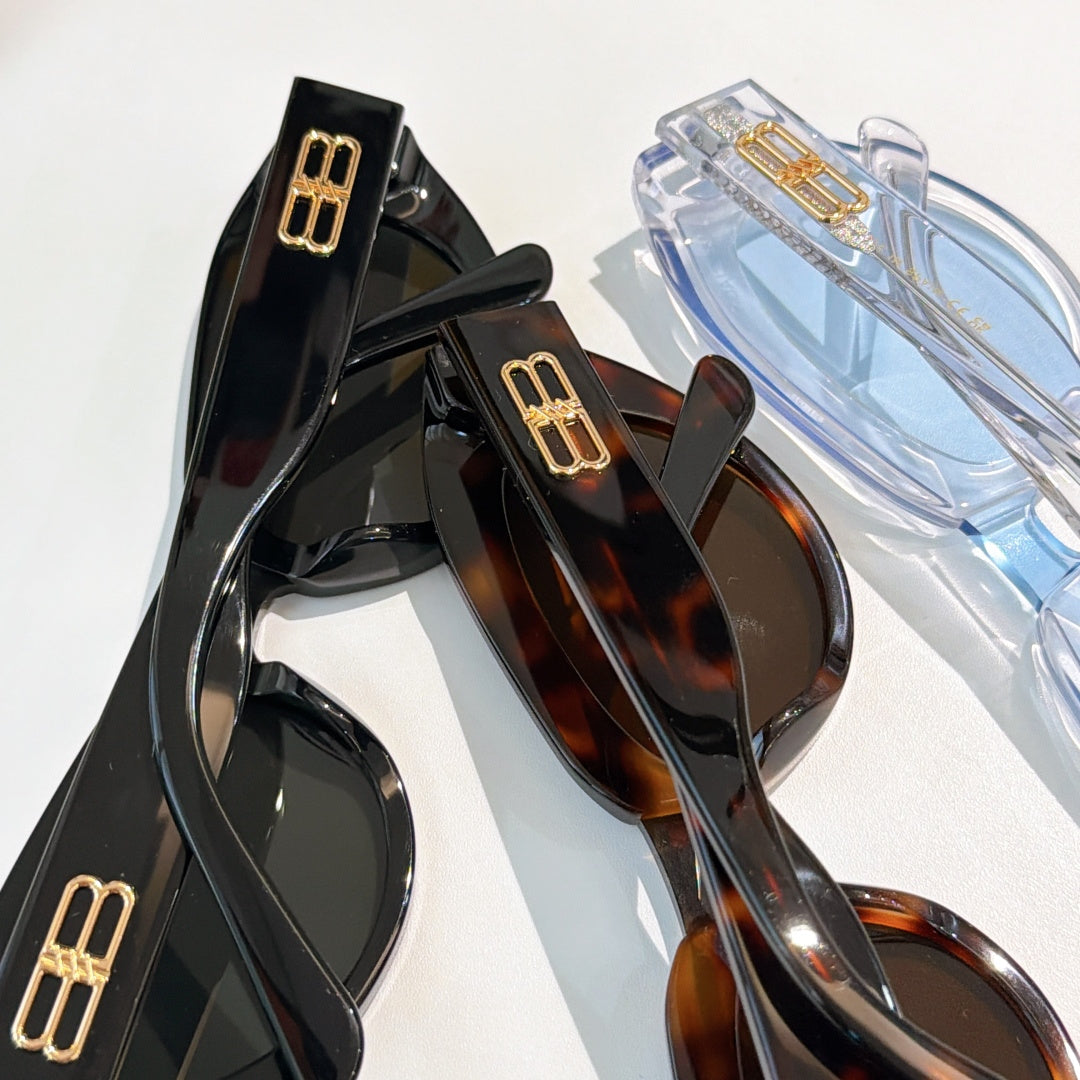 Balenciaga sunglasses assortment, black, tortoiseshell, and clear blue frames