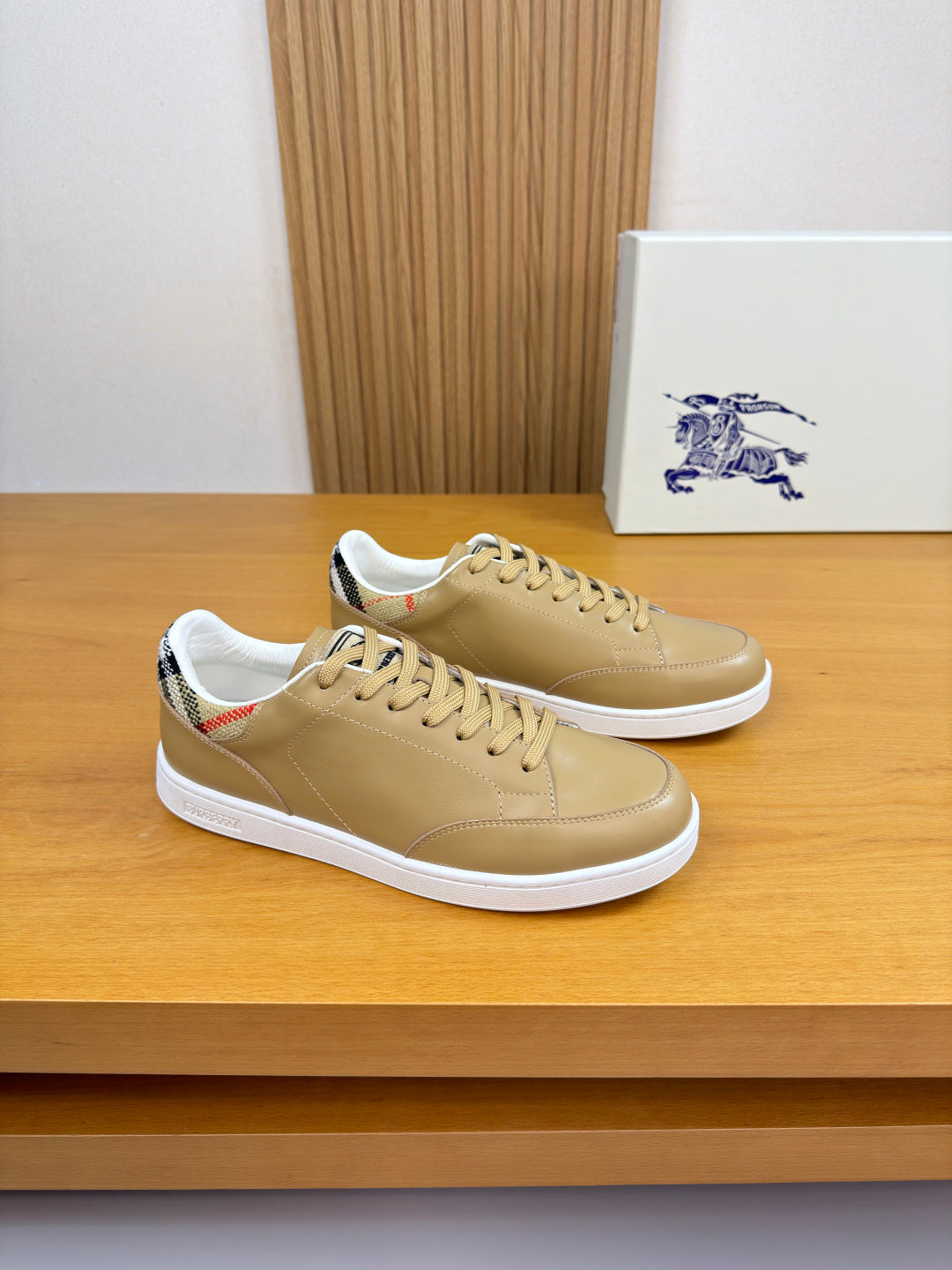 Burberry light tan leather sneakers with white sole and lace-up design