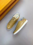 Burberry light tan low-top sneakers with lace-up front and patterned heel lining
