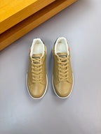 Burberry light tan sneakers, side view with lace-up front and padded collar