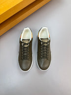 Burberry leather low-top sneakers, dark olive uppers with lace-up front and white sole