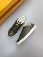 Burberry leather low-top sneakers pair, dark olive with lace-up design and white rubber sole