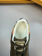 Burberry sneaker tongue and logo area, dark olive leather with lace-up and striped lining