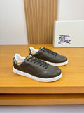 Burberry leather low-top sneakers in dark olive with black laces and white sole