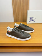 Burberry leather low-top sneakers in dark olive with black laces and white sole