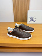 Burberry low-top sneakers in dark brown leather with white rubber sole and laces