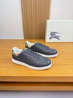 Burberry dark navy leather low-top sneakers, white rubber sole, lace-up front