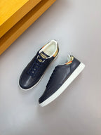 Burberry navy low-top sneakers with lace-up design and patterned inner lining
