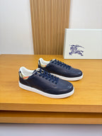 Burberry navy leather low-top sneakers with blue laces and white rubber sole