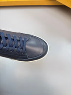 Burberry navy sneaker toe and laces, smooth leather upper with white sole edge