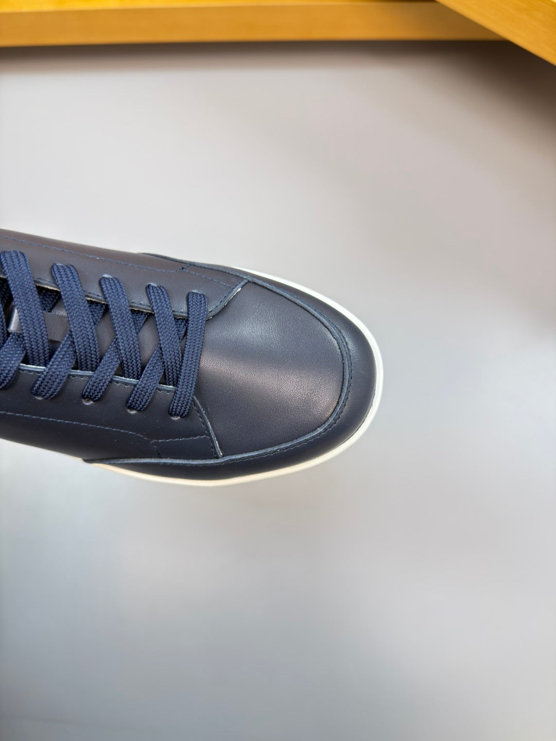 Burberry navy sneaker toe and laces, smooth leather upper with white sole edge